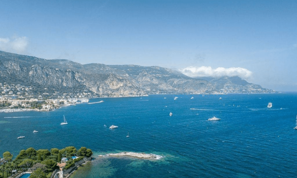 Panoramic sea horizon visible from landscaped grounds
